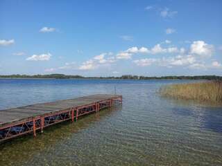 Дома для отпуска Bajkowy Domek Nad Samym Jeziorem Нарты Дом для отпуска-36
